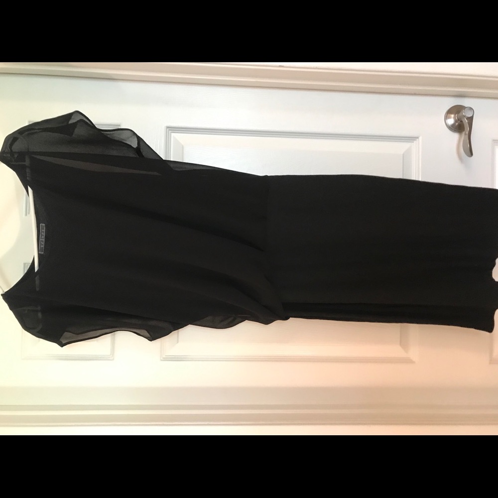 Black dress, flowy at top, straight at bottom